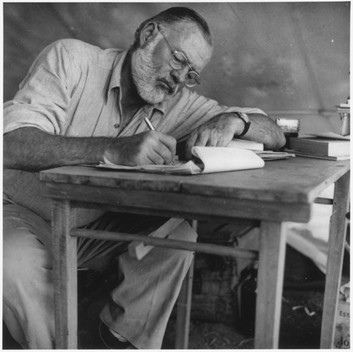 Ernest_Hemingway_Writing_at_Campsite_in_Kenya_-_NARA_-_192655-thumb-500x499-3662